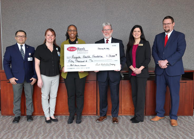 First Bank and Trust Company employees present Augusta Health leaders with Endowment Donation. Pictured left to right: Augusta Health leaders, Scott Crabtree, Vice President Professional Services, Vickie Taylor, Chief Nursing Officer and Shirley Carter, Executive Director of Augusta Health Foundation & Vice President of Philanthropy, along with First Bank and Trust Company leaders, John Bowers, SVP/Regional Manager for the Shenandoah Valley and Augusta Health Board Member, Erica Sayers, VP/Commercial Lender, and Bradley Dunsmore, SVP/Commercial Lender.