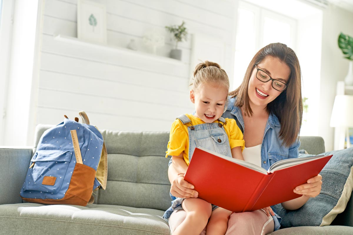 mother reading book to her child