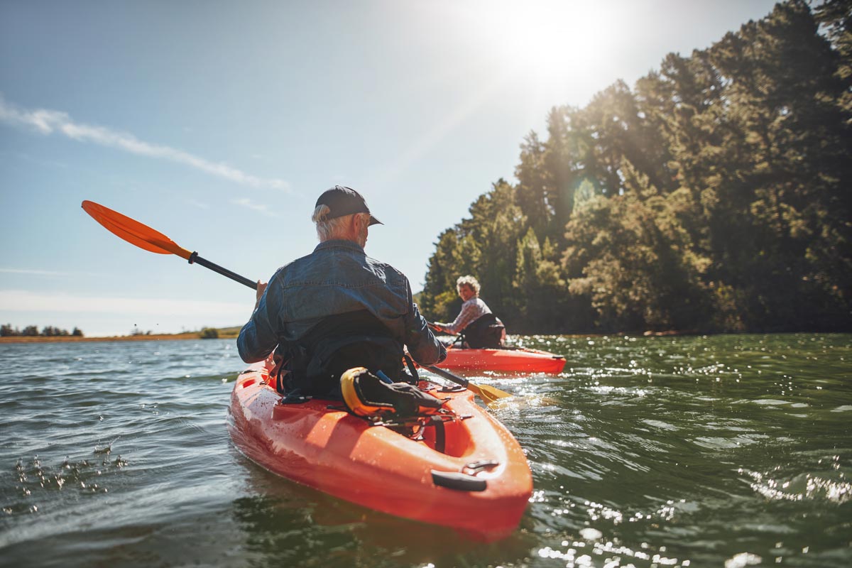 older man kayaking