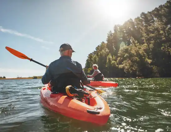 older man kayaking