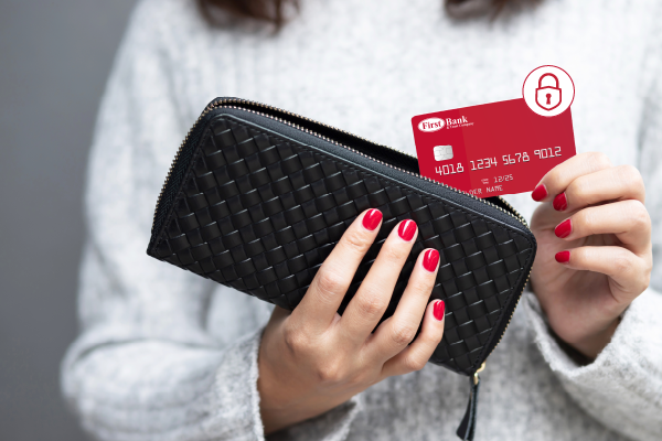 Woman Pulling Out First Bank Card From Wallet