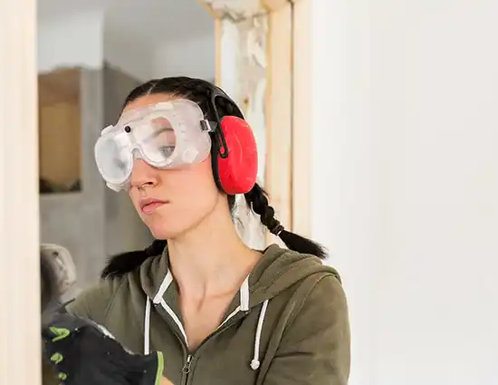 Woman Polishing Door Frame During Renovation