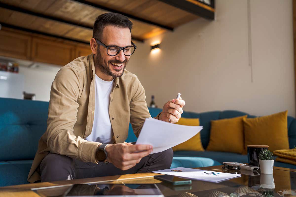 Bearded Man Holding Paper And Pen