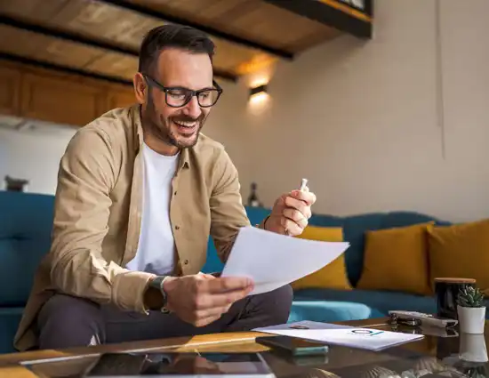 Bearded Man Holding Paper And Pen