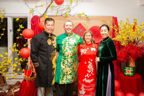 Jay Smith, wife, and customers in festive Lunar New Year attire