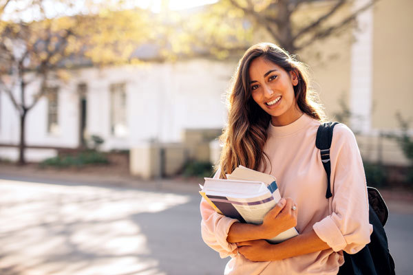 Woman With Long Hair Holding Books