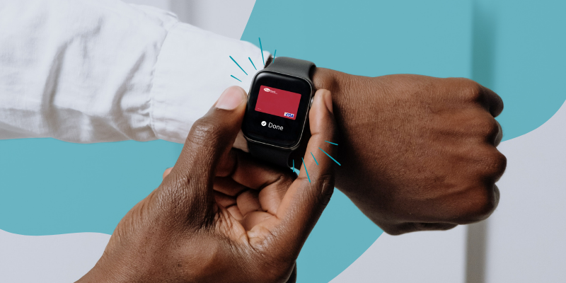 Using the digital wallet, a man pays using his First Bank and Trust debit card on his smartwatch.