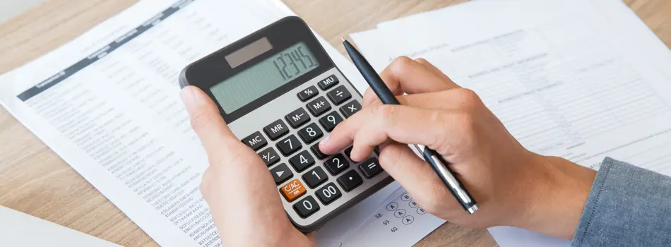 Person using calculator 