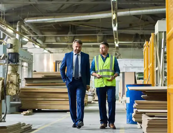 Business Man Talking To A Man In Vest