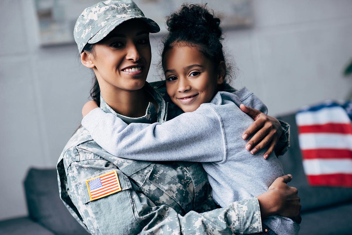 Smiling African American Daughter Hugging Mother
