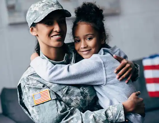 Smiling African American Daughter Hugging Mother
