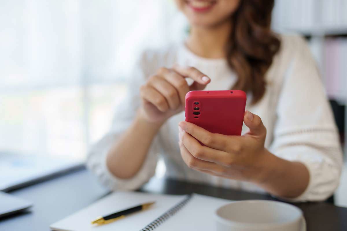 Woman Holding Red Iphone