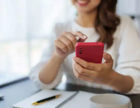 Woman Holding Red Iphone