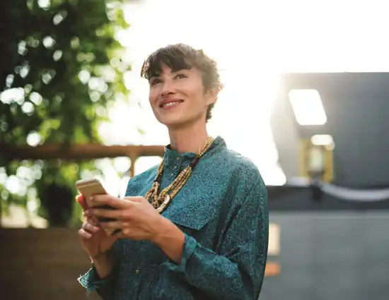 Woman smiling at phone