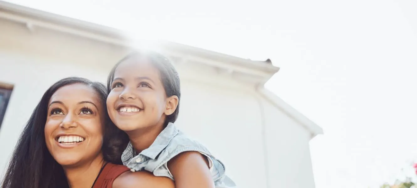 Mother and Daughter smiling