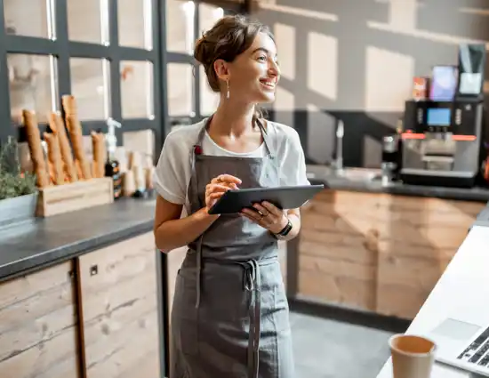Woman Using Tablet Coffehouse