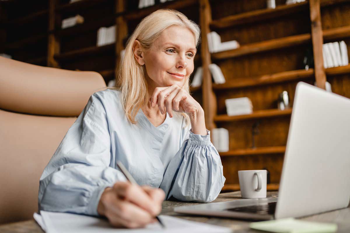 Blonde Woman Looking At The Computer
