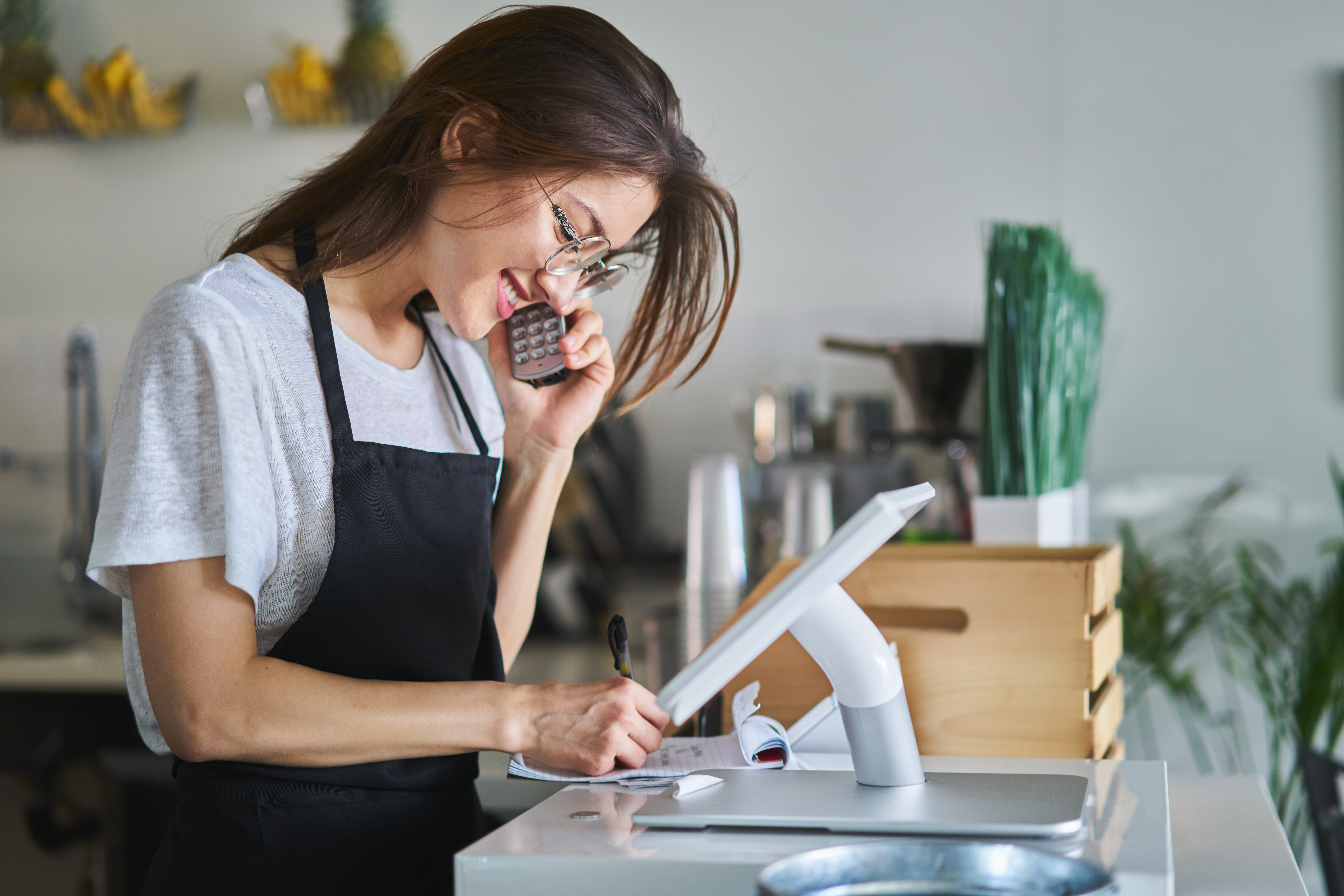 Woman Taking Order On Pos