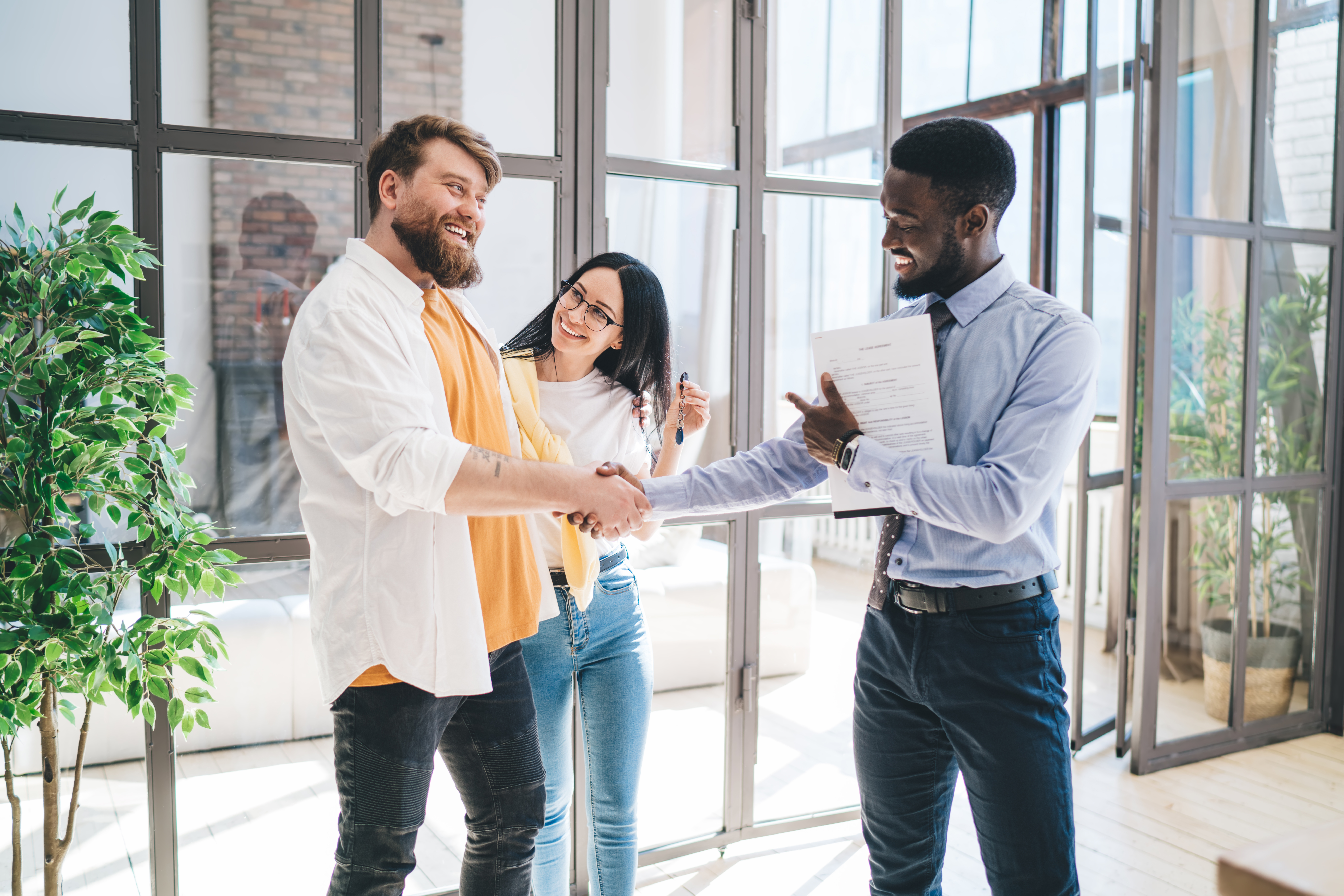 Winking Black Realtor With Contract And Happy Coup 2023 12 15 15 58 07 Utc