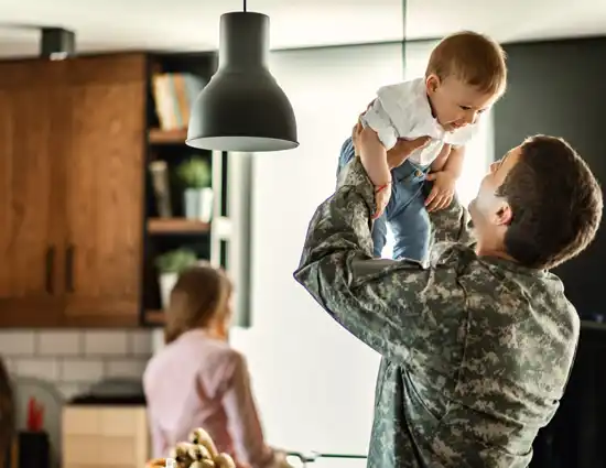 Playful Military Man Having Fun With His Small Son