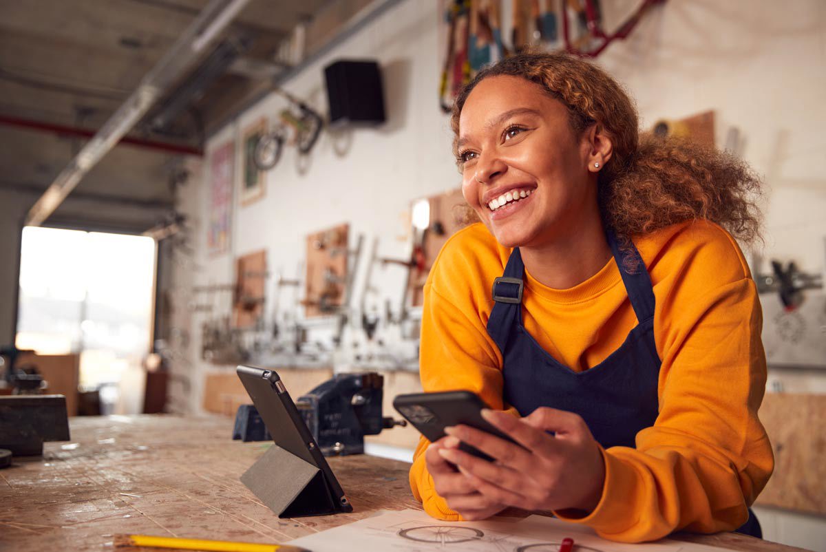 African American Woman In Yellow Shirt Smiling