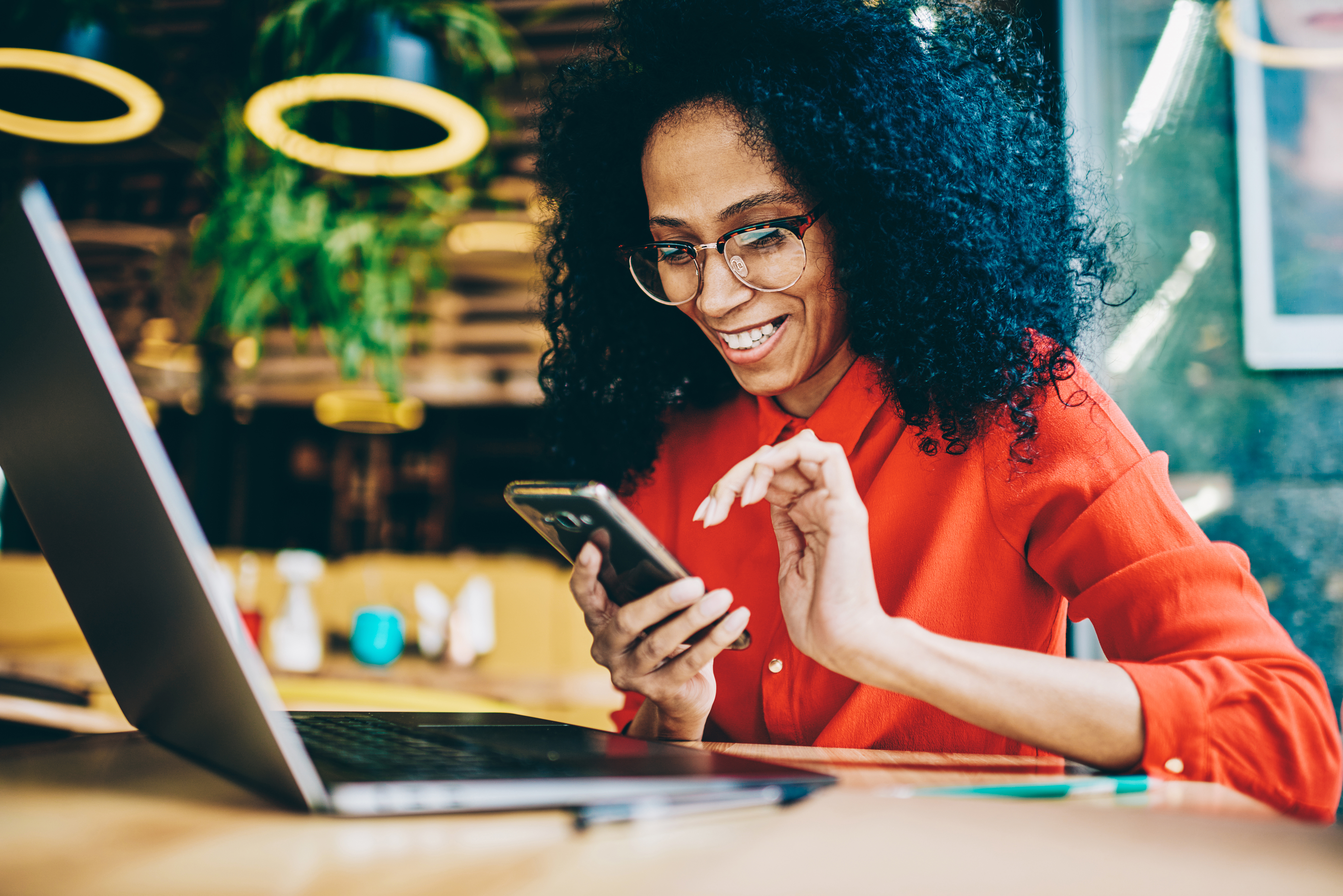 Women Smiling Looking At Phone