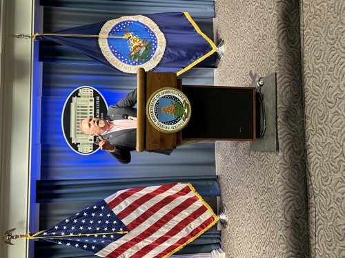 Nelson Powell speaking at podium