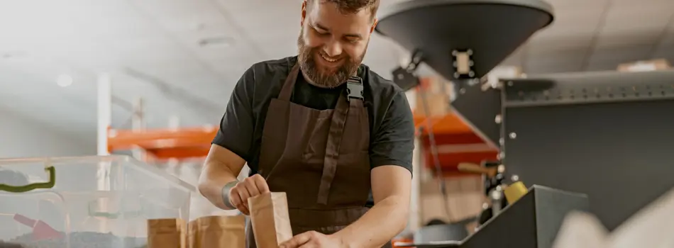 Business Owner Weighs Paper Bag With Coffee Beans 2023 11 27 04 49 39 Utc