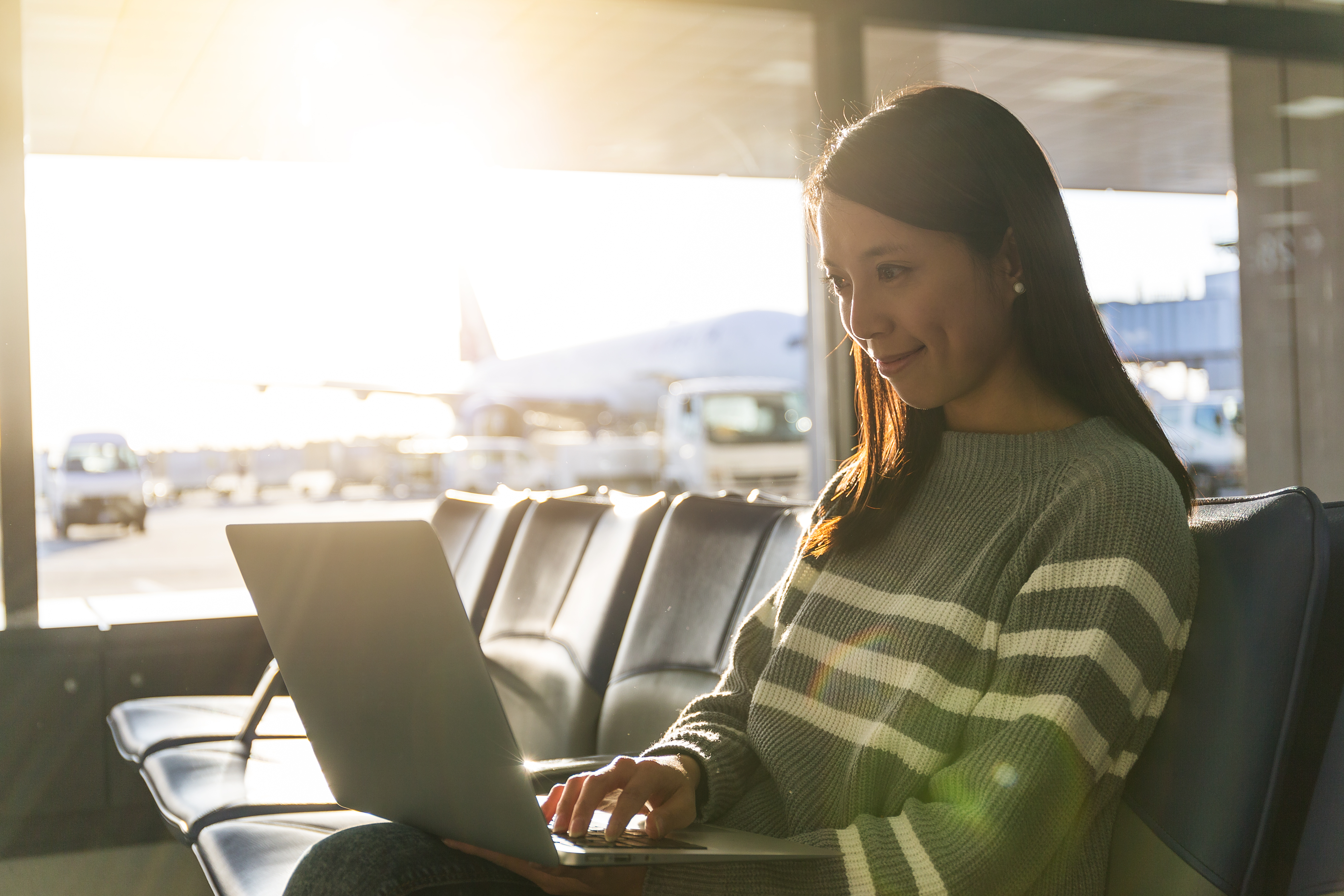 Woman Use Of Laptop Computer At Airport 2023 11 27 04 50 45 Utc
